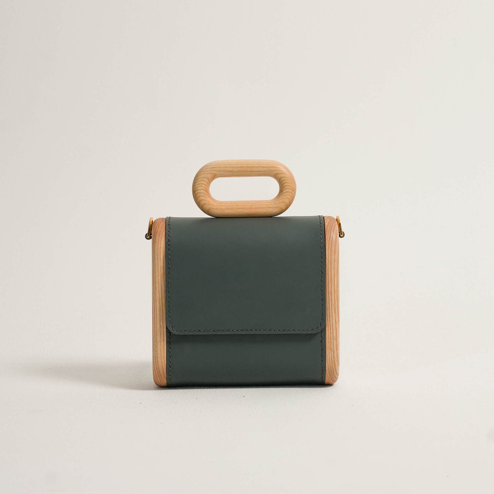 
                      
                        The Capsule Wooden Bag - Dark Grey
                      
                    