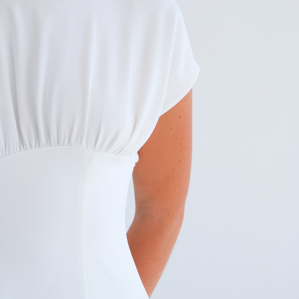 
                      
                        The Asymmetric Dress- Off-White
                      
                    
