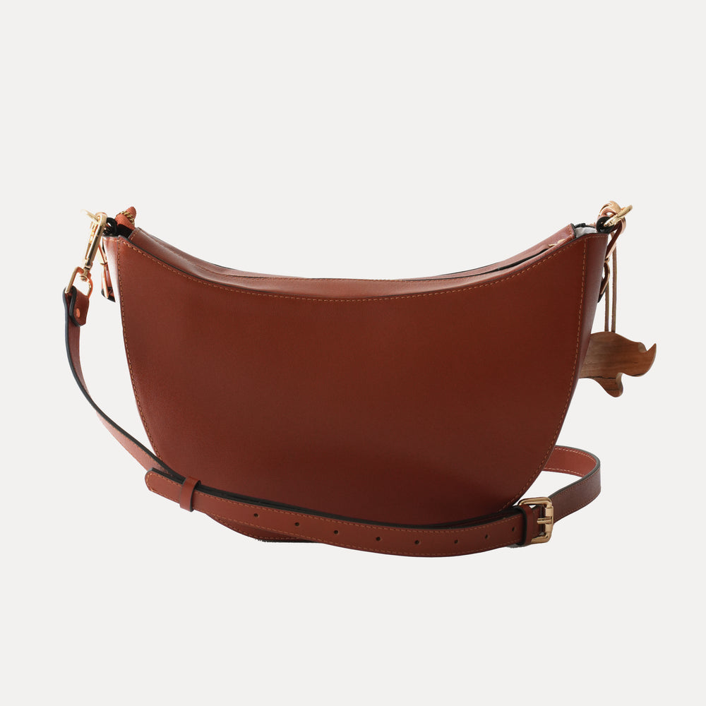 
                      
                        The Kamari Sling Bag - Burnt Orange
                      
                    